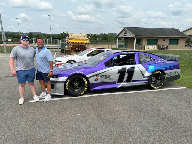Race car with attendees